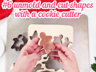 Cutting gingerbread man jigglers with cookie cutter.